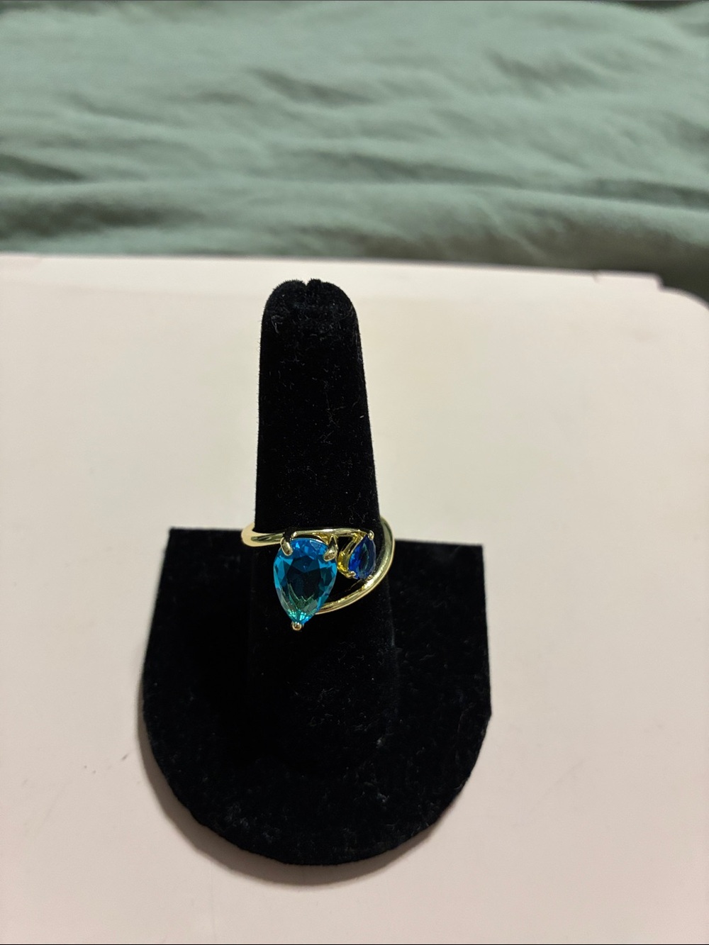 Gold tone Ring with Blue Teardrop Crystal